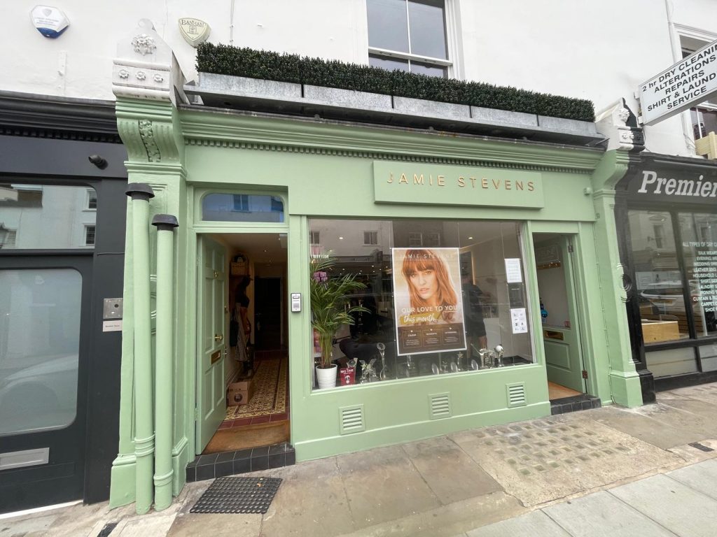 Completed shopfront restoration in heritage green for Jamie Stevens hair salon, High Street Kensington.